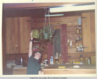 John, Jr. watering a plant