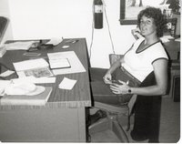 Soil Conservqtion worker Julie Falon Sits at office Desk
