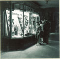 Students viewing College of Pharmacy window display, The University of Iowa, 1940s