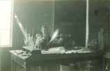 Blowing glass for chemistry lab equipment, The University of Iowa, 1930s