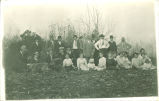 Group of people posing outside in autumn, Iowa, 1920s