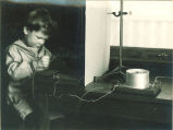 Boy with electric tablet, The University of Iowa, 1920s