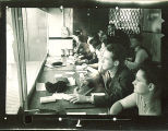 Researchers observing and taking notes behind screen, The University of Iowa, October 28, 1938