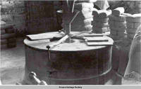 Interior of flour mill, West Amana, Iowa, 1900s