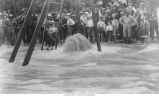Men and boys surrounding “Jumbo” artesian well, Belle Plaine, Iowa, late 1890s or early 1900s