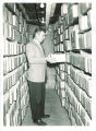 Staff member working in Iowa Geological Survey archives, The University of Iowa, March 1955