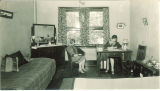Students reading and writing in a Currier Hall dorm room, The University of Iowa, May 1927