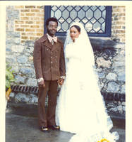 Ainsley Bernard standing with his bride 