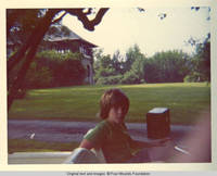 John, Jr. sitting in golf cart