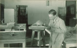 Don Gould modeling glyptodon, The University of Iowa, 1920s