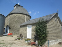 015.  Concrete corn crib and feed shed