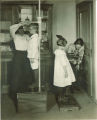 Measuring children's height and weight, The University of Iowa, ca. 1920