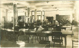 Students studying in the Main Library in Macbride Hall, the University of Iowa, 1910s