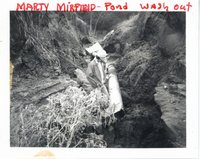 Marty Mirfield looking at pond washout, 1980