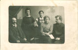 Men with mustaches and women posing for portrait, Iowa, 1900s