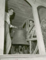 Homecoming Co-Chairmen Jerry Whittlesey and Dave Lebuhn beside the Victory Bell, 1954