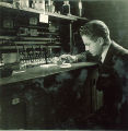 Man using a dropper for an experiment, The University of Iowa, 1930s