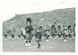 Scottish Highlanders performing at football game, The University of Iowa, October 26, 1948