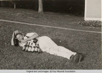Sandy James spawled out on lawn