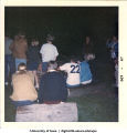 Gathering around a campfire, The University of Iowa, October 1967
