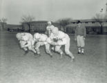 Vince DiFrancesca with footbal players, 1956