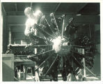 Engineering student working on airplane engine, The University of Iowa, 1950s