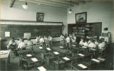 Students reading in small groups, The University of Iowa, May 19, 1932