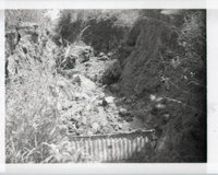 Rocky Ravine Dirt Stopped by Barrier