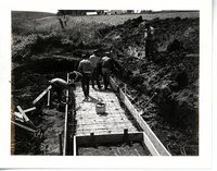 Construction of water control structure on Sonksen farmland.