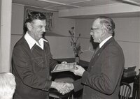 1976 Dwight Stucker aceepts award