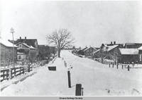 Street scene of "back street" in winter, Amana, Iowa, 1900s