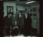 Library personnel with artifact, The University of Iowa, 1950s