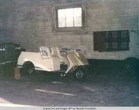 Golf cart inside barn
