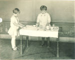 Schoolgirls setting table in Miss Watkins' room, The University of Iowa elementary school, October 1921