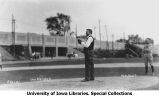 Governor N.E. Kendall on baseball pitching mound with glove, Iowa Field, The University of Iowa, May 13, 1922