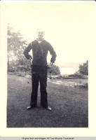 Ray Heitzman in uniform standing in rock garden