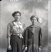 Woman and girl standing