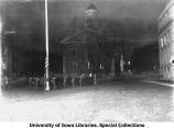 Cadets retiring the American flag on Pentacrest, The University of Iowa, 1918