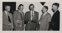 Awarding Soil Conservation Achievement Plaques.
