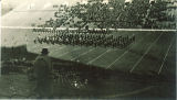 Marching band and Scottish Highlanders performance at football game, The University of Iowa, October 1938