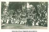 Crowd of people seated on hillside, The University of Iowa, 1915