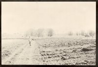 Faded photo of man  standing in field