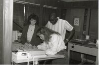 1988  Kathy Baughman, Terry Cosby, and Lisa Neidermayer work on a project for the Des Moines County Soil and Water Conservation District