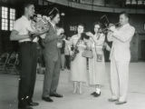 Alumni band performing at a Homecoming event, 1956