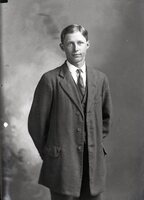 Man in coat, standing