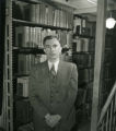 Robert W. Orr poses for portrait in the tiers, 1951