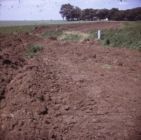 Building tile inlets on terraces on Byrl Elliot's farm.