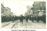 Marching band in Mecca Day parade heading west on Washington St., The University of Iowa, 1920