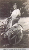 John Heitzman on a hay mower
