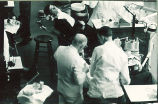 Faculty member teaching a dental student in a clinic, The University of Iowa, 1950s